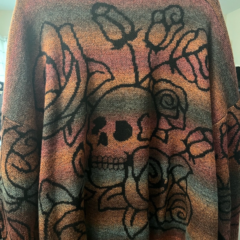 Torrid Orange and Black Crewneck Sweater with Artistic Skull Design